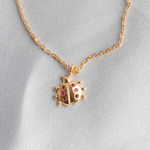 Pulseira infantil com pingente joaninha