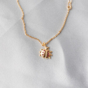 Pulseira infantil com pingente joaninha